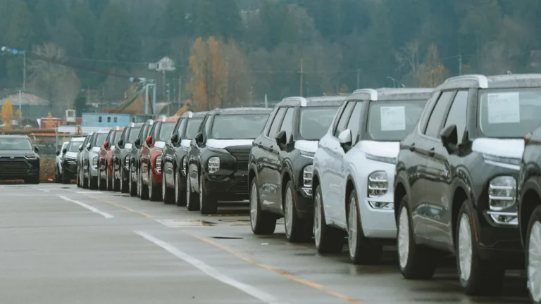 Rows of new SUVs parked in a dealership lot