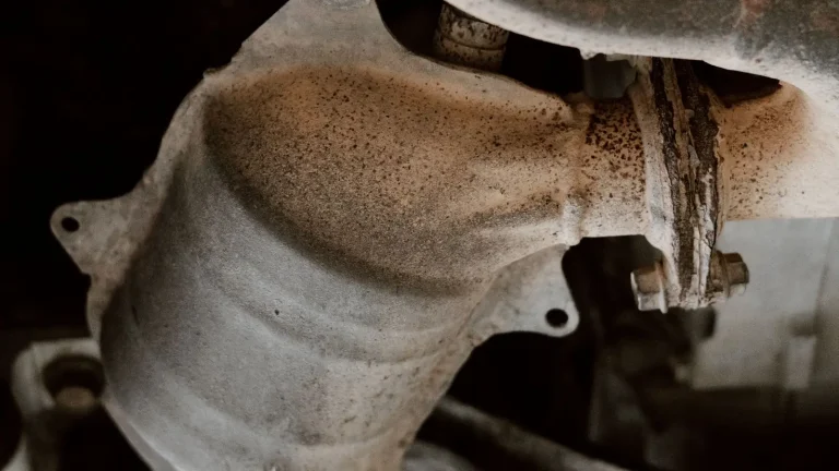 Underside of a car showing the exhaust pipe and catalytic converter, the part a P0420 code tests