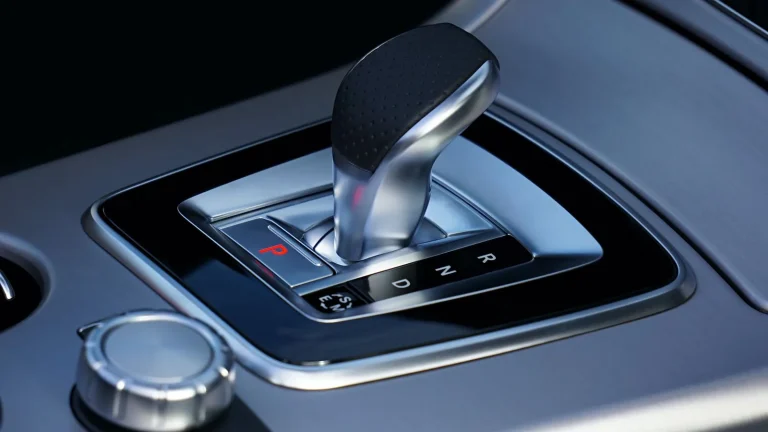 Close-up of an automatic transmission gear selector in a car interior
